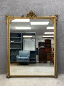 A 19th century carved and gilt overmantel mirror having a carved cresting with shell and acanthus