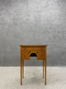 An George III satinwood side table having a kingwood crossbanded and ebony inlaid top hand painted