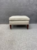 A Georgian style George Smith run up stool upholstered in a cream tween linen raised on square
