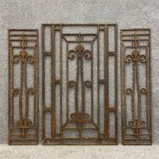 A pair of early 20th century Art Deco cast iron architectural panels along with a larger matching