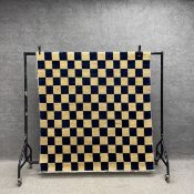 A contemporary woollen Afghan Choobi carpet having an all-over chequered pattern in midnight blue