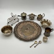 A collection of silver plate to include and embossed and scalloped salver, a toast rack, two tea