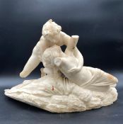 A 19th century Italian School hand carved alabaster figure group depicting Cupid and Psyche on a
