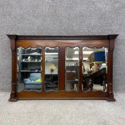 A late 19th century mahogany overmantel mirror having a dentil moulded breakfront cornice above a