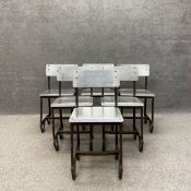 A set of six early to mid 20th century industrial chairs each having a cut and formed stainless