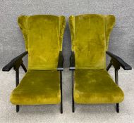 A pair of mid to late 20th century Danish style wingback armchairs upholstered in two tone velour