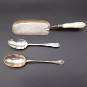 A hallmarked silver serving spoon and a silver plated example along with a hallmarked silver crumb