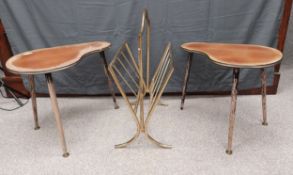 A pair of mid-century kidney shaped or boomerang teak side tables with brass collars on round