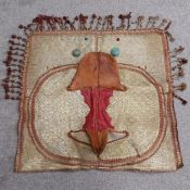 A 19th century Moroccan/North African red and tan leather equestrian saddle with a tall narrow