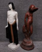 Two early 20th century figural statues to include an Art Deco Egyptian revival painted chalkware
