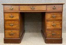 A late 19th century mahogany pedestal desk of small size in three parts, having a tooled leather top