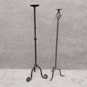 Two wrought iron floor standing candle holders. H.118cm (tallest)