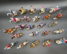 A collection of twenty four hand painted metal toy cavalry figures in 19th century style and