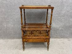 A mid 19th century burr walnut Canterbury whatnot with a pierced brass gallery rail on a quarter