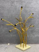 A mid-century gilt metal floor lamp of naturalistic form having six reed like branches with