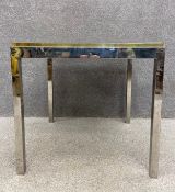 A 1970's vintage chrome and brass games table with lift out reversible top. H.75.5 W.80 D.80cm