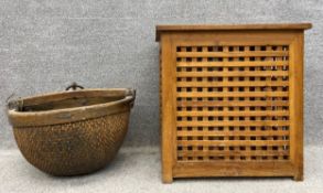 An early 20th century Chinese woven basket with a hardwood handle and rim, along with a contemporary