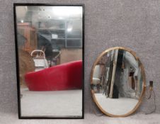 Two mirrors to include one mid-century in a painted black frame, and another early to mid 20th