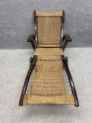 A vintage adjustable steamer chair. H.83 (in upright position) L.182 (flat) W.74cm. In need of