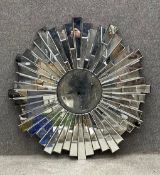 A contemporary Art Deco style sunburst mirror. Dia.101cm (Four sections with cracks as seen).