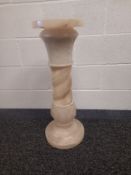 An early 20th century carved alabaster pedestal column in five sections. H.73cm (four pedestal