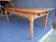 A Victorian pine single drawer farmhouse table on turned tapering supports. L.214 H.75 W.89cm