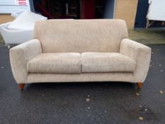 A Sox Kamen two seater sofa on splayed tapering supports. L.170cm D.85cm