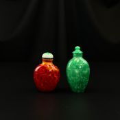 A 19th century Chinese Qing dynasty mottled red glass snuff or perfume bottle with stopper along