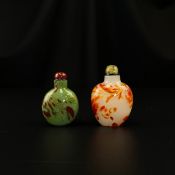 Two 19th century Chinese Qing dynasty snuff bottles to include one of baluster form with flecks of