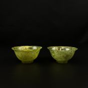 A pair of Chinese spinach jade tea bowls. H.5cm