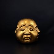 A large Chinese carved giltwood four faced Buddha. H.26cm