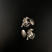 A pair of hallmarked .925 silver horse and jockey cufflinks.