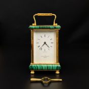 A brass and malachite mounted carriage clock by The London Goldsmiths Company, Pall Mall, having a