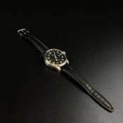 An Austin Kaye gentleman's military style watch having a black dial bearing luminescent numerals