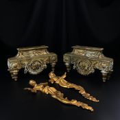 A pair of 19th century footed brass stands, possibly clock garnitures, each having a central