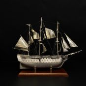 An Italian hallmarked .925 silver model of H.M.S. Victory on a moulded mahogany plinth base,