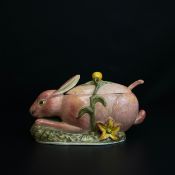 A large hand decorated Italian Majolica figural sauce tureen with cover and spoon, a rabbit among