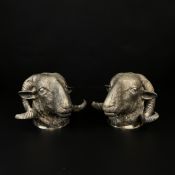 A pair of cast steel ram's heads. H.14cm