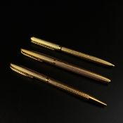 A collection of three pens to include a Waterman gold plated CF model barley grain stylo plume