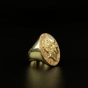 A hallmarked 14ct gold signet ring having a portrait in relief of a Roman emperor in an oval cartou