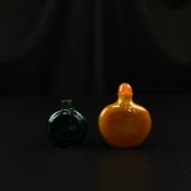 Two 19th century Chinese Qing dynasty snuff bottles to include one amber coloured glass bottle of f