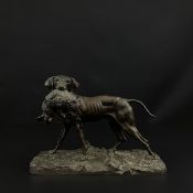 In the manner of Pierre Jules Mene (1810-1879), a patinated bronze figure group of a hunting dog and