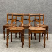 A set of five 19th century East Anglian elm dining chairs each having a banded top rail above a