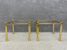 A pair of polished brass Hollywood Regency style side tables on four octagonal pillar supports. (