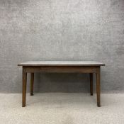 A mid 20th century industrial style dining table or work bench having a stainless steel sheet