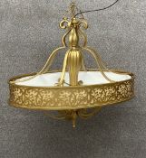 A contemporary brass carabel pendant light or chandelier having a central reeded column with six