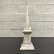 A late 19th century white marble obelisk (with repair to the spire as seen). H.48cm