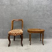 A 19th century child's walnut balloon back chair with a needlework upholstered serpentine fronted