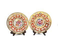 A pair of early 19th century Coalport plates, hand painted with the Orange Church Gresley pattern,