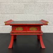 A late 19th/early 20th century Japanese black and red lacquered sutra, offering or altar table